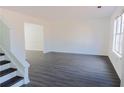 Spacious living room featuring gray vinyl plank flooring at 5055 Promenade Sw Dr, Atlanta, GA 30331