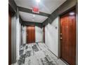 Building hallway with modern flooring and doors at 400 W Peachtree Nw St # 2810, Atlanta, GA 30308