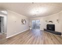 Spacious living room featuring hardwood floors and fireplace at 970 Sidney Marcus Ne Blvd # 2113, Atlanta, GA 30324