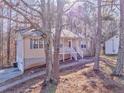 House exterior with a spacious yard and attached garage at 396 Southern Trace Dr, Rockmart, GA 30153