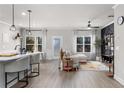Open living space with kitchen island and hardwood floors at 5535 Rockfern Dr, Lilburn, GA 30047
