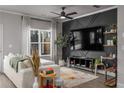 Living room features a large TV and stylish shelving at 5535 Rockfern Dr, Lilburn, GA 30047
