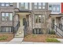Modern townhome brick facade, stairway entrance, with minimalist landscaping at 400 Pratt Se Dr # 1403, Atlanta, GA 30315