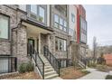 Stairway entrance to modern townhome with brick facade and black trim at 400 Pratt Se Dr # 1403, Atlanta, GA 30315