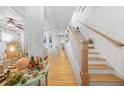 Bright hallway with hardwood floors and staircase at 817 Mclendon Dr, Scottdale, GA 30079