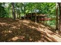 House nestled in a wooded area, elevated position at 4955 H D Atha Rd, Covington, GA 30014