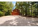 Two-story home with attached garage, wooded setting at 4955 H D Atha Rd, Covington, GA 30014