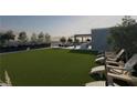 Expansive rooftop lawn is complemented by lounge chairs and an outdoor kitchen perfect for entertaining and relaxation at 318 Sandy Springs Cir # 250, Sandy Springs, GA 30328