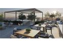 A stunning rooftop terrace boasts dining and lounging options, complemented by lush plantings and a tranquil pool at 318 Sandy Springs Cir # 250, Sandy Springs, GA 30328