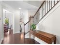 Bright entryway with hardwood floors and elegant staircase at 3587 Adelaide Xing, Brookhaven, GA 30319