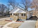 Newly built home with a front porch and driveway at 629 Elmwood St, Canton, GA 30114