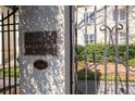 The Ansley Arms building entrance with gate at 1230 Piedmont Ne Ave # 405, Atlanta, GA 30309