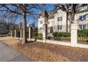 Building exterior with fence and trees at 1230 Piedmont Ne Ave # 405, Atlanta, GA 30309