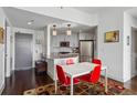 Modern dining area with red chairs and a patterned rug at 1100 Howell Mill Nw Rd # 610, Atlanta, GA 30318