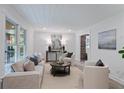 Bright living room with light beige sofas and a coffee table at 2100 Wood Ct, Marietta, GA 30062