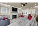 Spacious living room with sectional sofa, fireplace, and large TV at 3179 Clairebrooke Ave, Atlanta, GA 30341