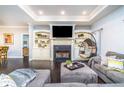 Comfortable living room featuring a fireplace, built-in shelves, and a hanging bubble chair at 4801 Daniel Mill Rd, Winston, GA 30187
