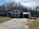 A freshly painted home with driveway and two car garage at 2715 Heritage Ln, Morrow, GA 30260