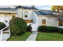 Charming two-story home with well-manicured landscaping and a white picket fence at 2678 Greentree Se Dr, Marietta, GA 30067