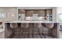 Kitchen island with white countertop and seating for four barstools at 215 Arizona Ne Ave # 2, Atlanta, GA 30307