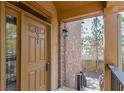 Front door entrance with brick wall and wooden steps leading to a backyard at 3021 Quantum Ln, Chamblee, GA 30341