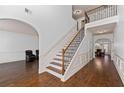 Two story foyer with hardwood floors and an elegant staircase at 313 Pennant Ln, Fairburn, GA 30213