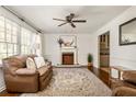 Cozy living room with fireplace, hardwood floors, and comfortable seating at 3512 Casa Woods Ln, Clarkston, GA 30021