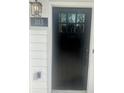 Black front door with glass panels and modern hardware at 310 Mcdonough Blvd # 103, Atlanta, GA 30315