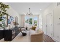 Bright living room with modern lighting, neutral tones, and stylish furnishings at 310 Mcdonough Blvd # 103, Atlanta, GA 30315