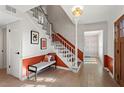 Bright entryway with staircase, bench, and terracotta accents at 5371 Tall Oak Dr, Marietta, GA 30068