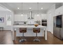 Spacious kitchen with white cabinets, island, and stainless steel appliances at 6320 Halcyon Garden Dr, Alpharetta, GA 30005