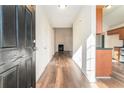 Bright entryway with hardwood floors and views into living room and kitchen at 1013 Bluecoat Cir, Hampton, GA 30228