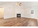 Spacious living room with hardwood floors and a fireplace at 1013 Bluecoat Cir, Hampton, GA 30228