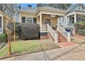 Quaint home with a welcoming porch and brick stairs leading to the entrance at 725 Oakland Se Ave, Atlanta, GA 30315