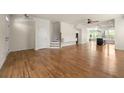 Spacious living room with hardwood floors offering an open concept layout at 1284 Park Bench Pl, Mableton, GA 30126
