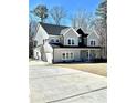 Charming two-story home with a covered front porch and attached garage in a nice neighborhood at 4863 Amsler Rd, Ellenwood, GA 30294