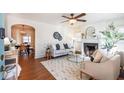 Bright living room featuring a fireplace, hardwood floors, and comfy seating at 230 Lindbergh Dr, Atlanta, GA 30305