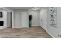 Bright entryway with wood-look floors and neutral walls at 1606 Fieldgreen Overlook, Stone Mountain, GA 30088