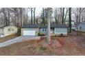 Cute ranch home with a carport and mature trees at 1606 Fieldgreen Overlook, Stone Mountain, GA 30088