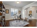 Cozy sitting room with a large window, comfortable seating, and unique decor on hardwood floors at 1567 Brunswick St, Lithia Springs, GA 30122