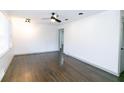 Bright living room with hardwood floors and ceiling fan at 2105 Fellowship Rd, Tucker, GA 30084