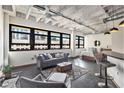 Spacious loft living area with large windows and exposed beams at 878 Ne Peachtree Ne St # 634, Atlanta, GA 30309