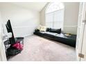 Office features a black couch and arched window at 320 Kentshire, Lawrenceville, GA 30044