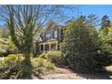 Two-story home with mature trees and landscaping at 120 Fountain Oak, Villa Rica, GA 30180