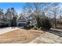 Inviting two-story home with attached garage and beautifully landscaped front yard at 120 Fountain Oak, Villa Rica, GA 30180