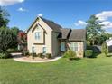 Tan house with stone accents and a landscaped yard at 1131 Orr Rd, Jonesboro, GA 30238