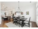 Open concept dining area with a view into a modern kitchen at 6829 Crescendo Ct, Atlanta, GA 30328