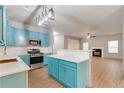 Bright kitchen featuring blue cabinetry, stainless steel appliances, and a modern island at 3236 Tallon Sw Ln, Atlanta, GA 30311