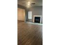 Spacious living room with modern flooring, fireplace, and ample natural light at 3236 Tallon Sw Ln, Atlanta, GA 30311