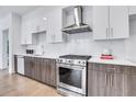 Modern kitchen features stainless steel appliances and wood cabinets at 775 Juniper Ne St # 405, Atlanta, GA 30308